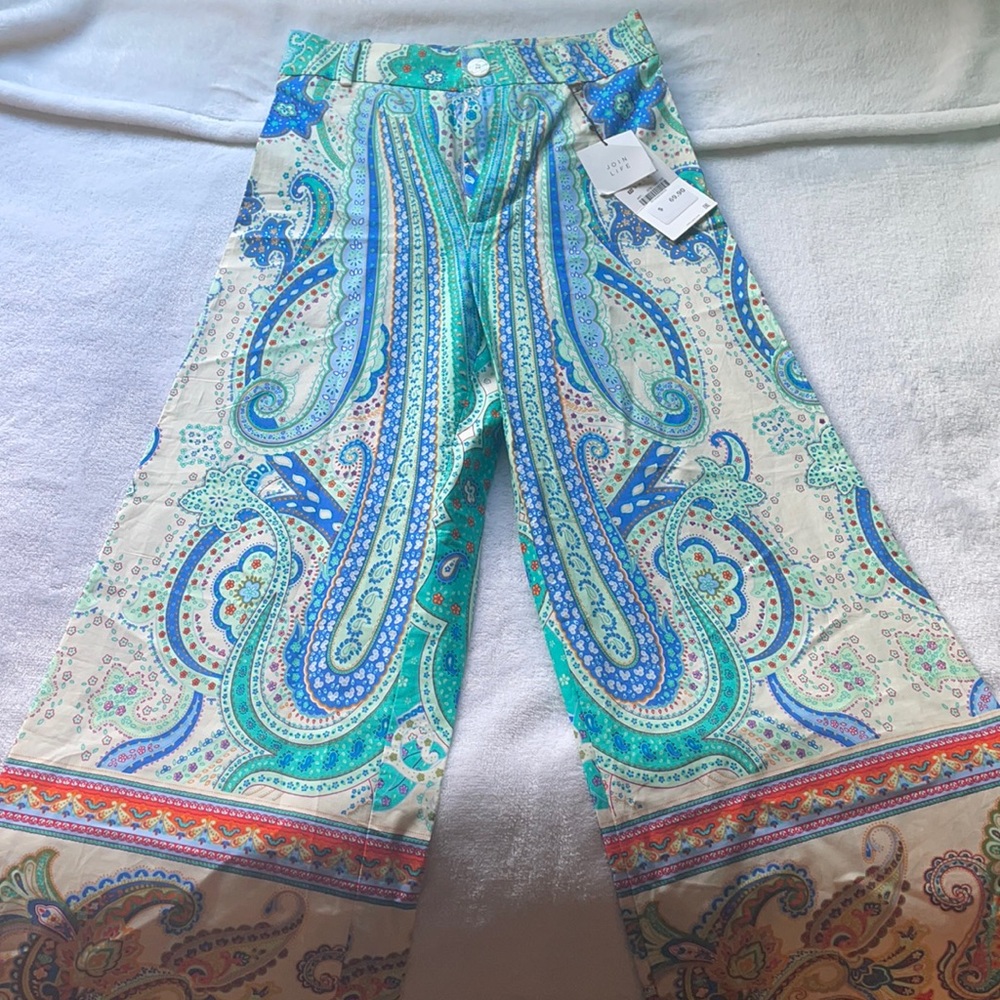 Xsmall paisley pants , have a flare to the bottom. Capri style